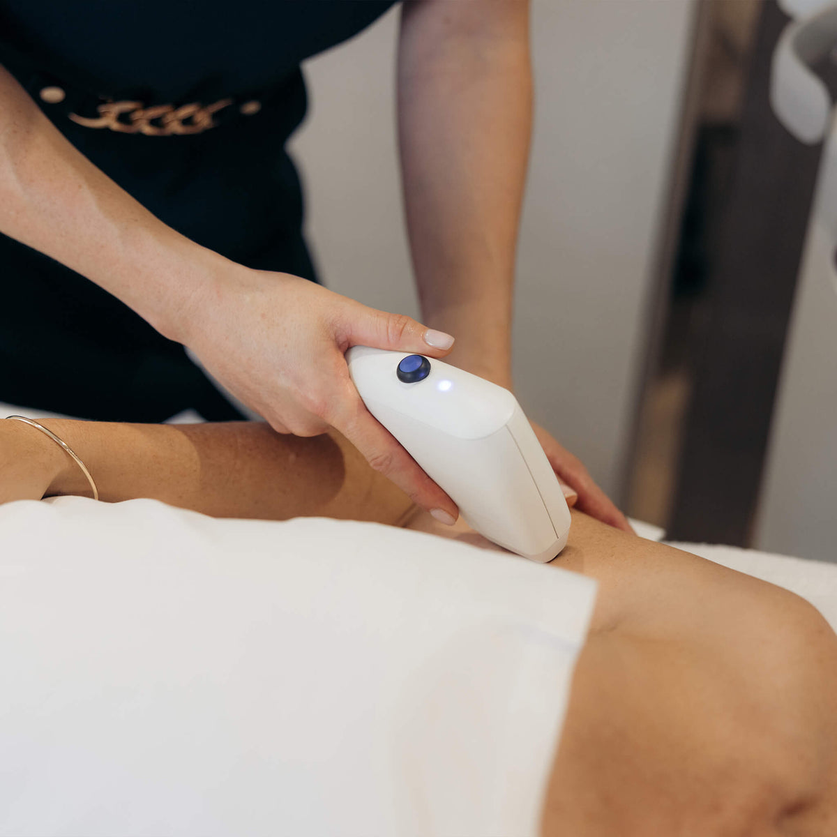 Sofwave applied to a woman's arm after applied to her face by a trained Dermal Therapist and Aesthetic Doctor at All Saint Clinic in Sydney