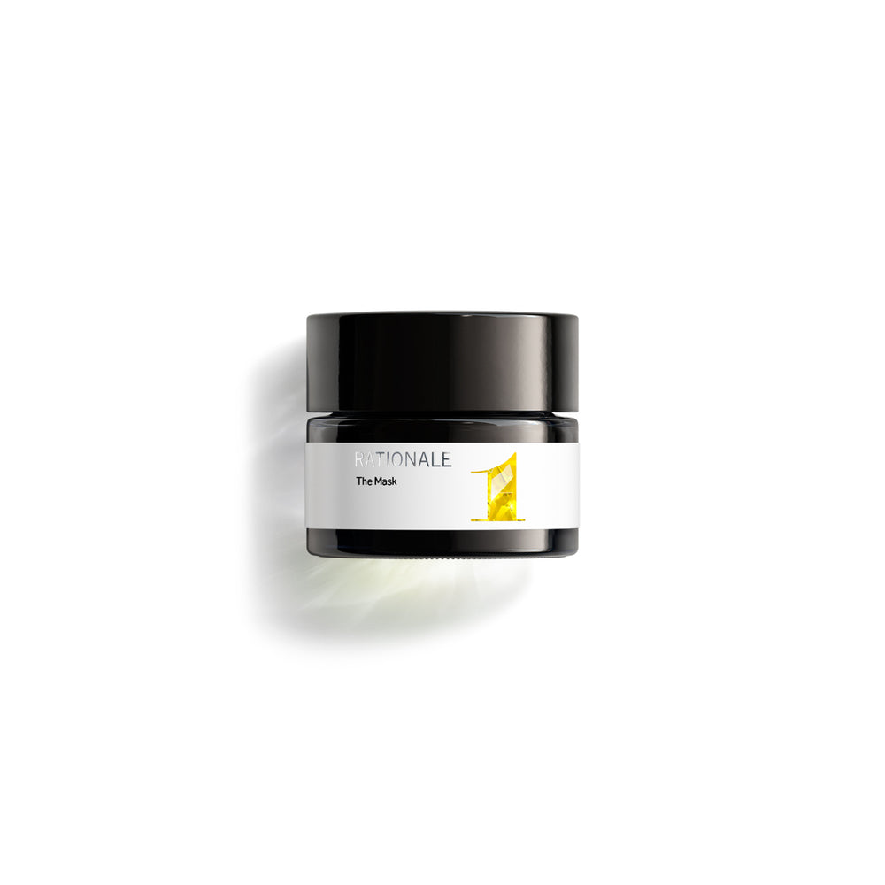Small dark glass jar of RATIONALE The Mask