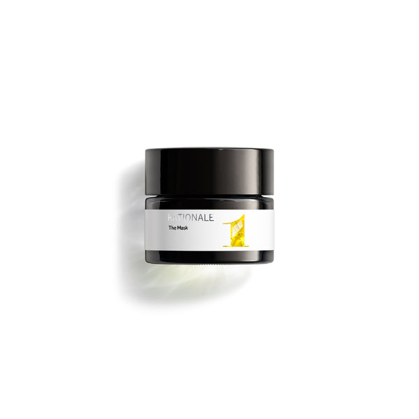 Small dark glass jar of RATIONALE The Mask