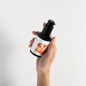 Hand holds a black pump bottle labeled RATIONALE