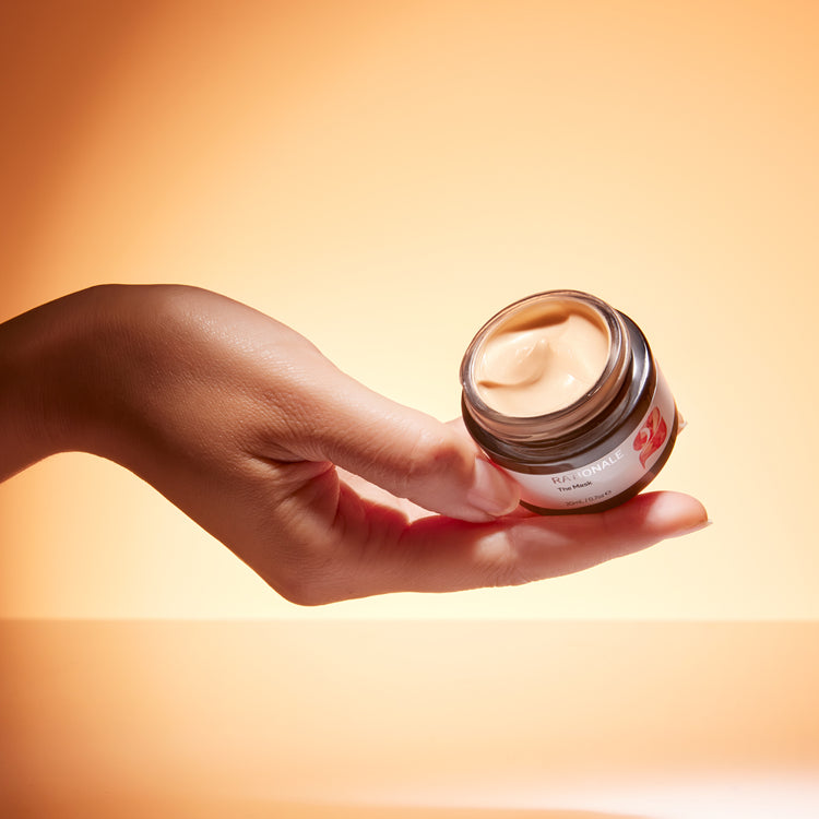 Hand holds open bottle of The Mask 2