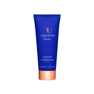 Blue tube of Augustinus Bader body cream on a white background