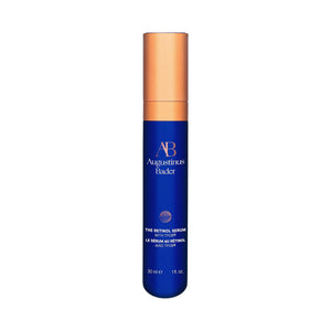 Augustinus Bader Retinol Serum in blue skincare serum bottle with gold cap on a white background