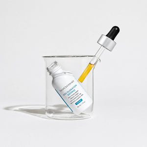 Skinceuticals serum bottle with dropper on a light gray background