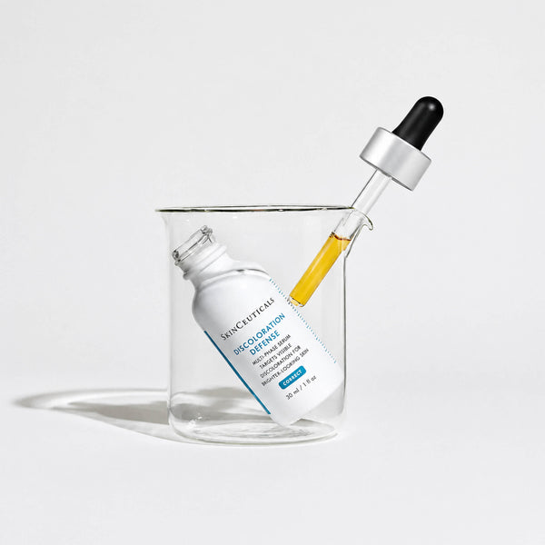 Skinceuticals serum bottle with dropper on a light gray background